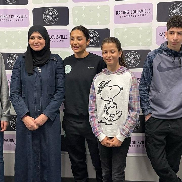 Nadia Nadim with families posing for photo